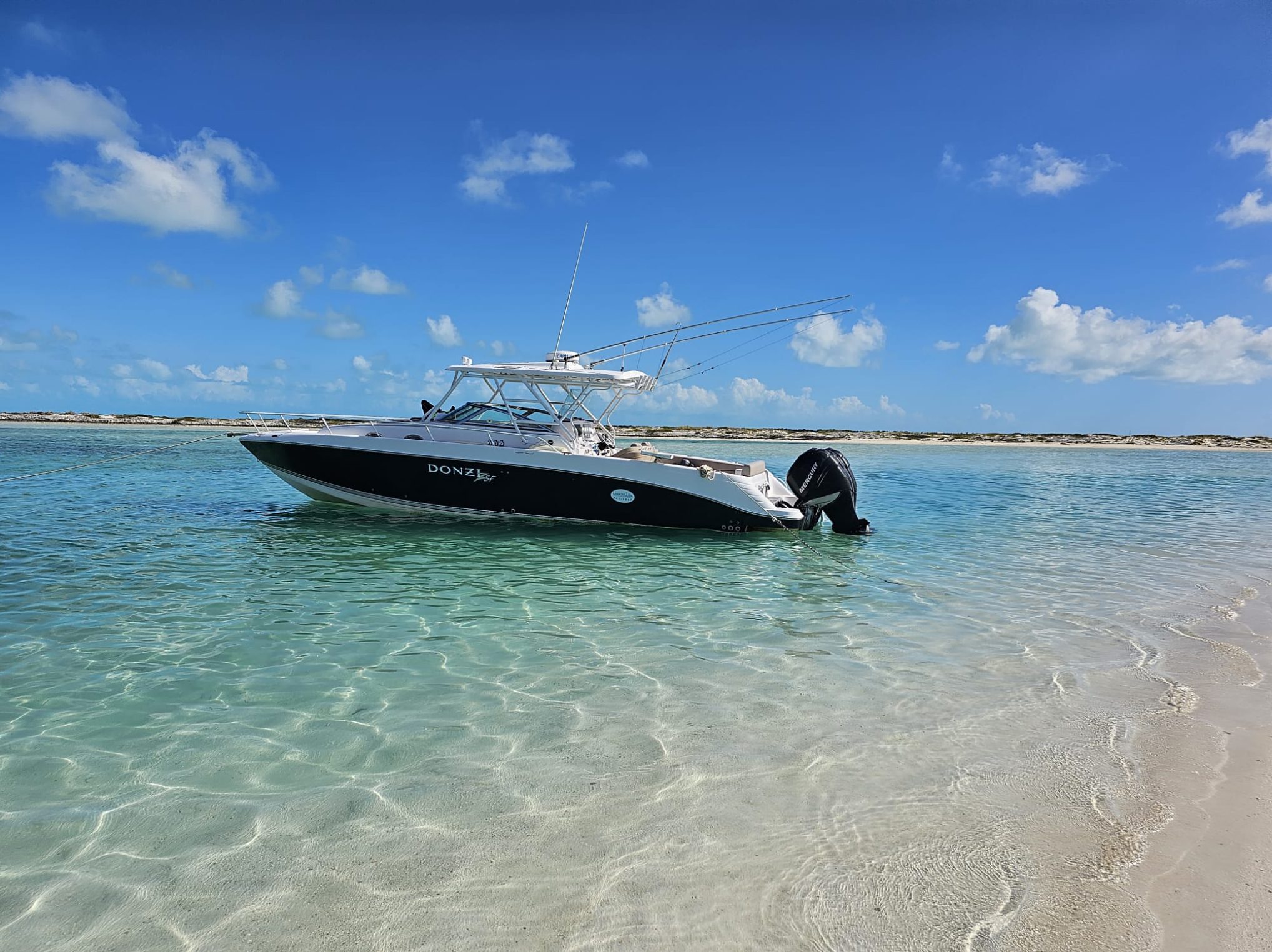 Catch the Wave's 38-foot Donzi in the clear island shallows.