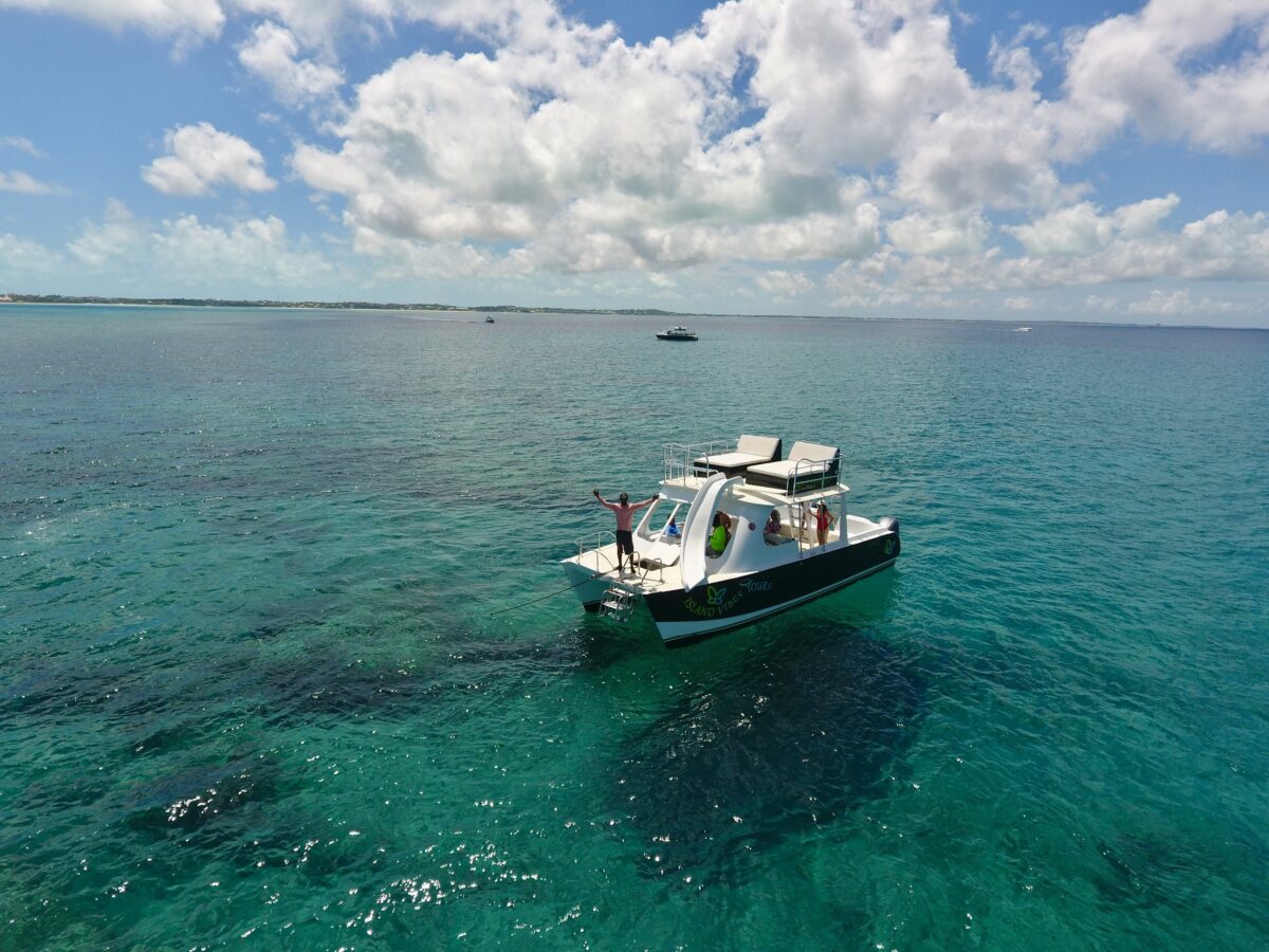 An Island Vibes catamaran with its waterslide and upper lounge.